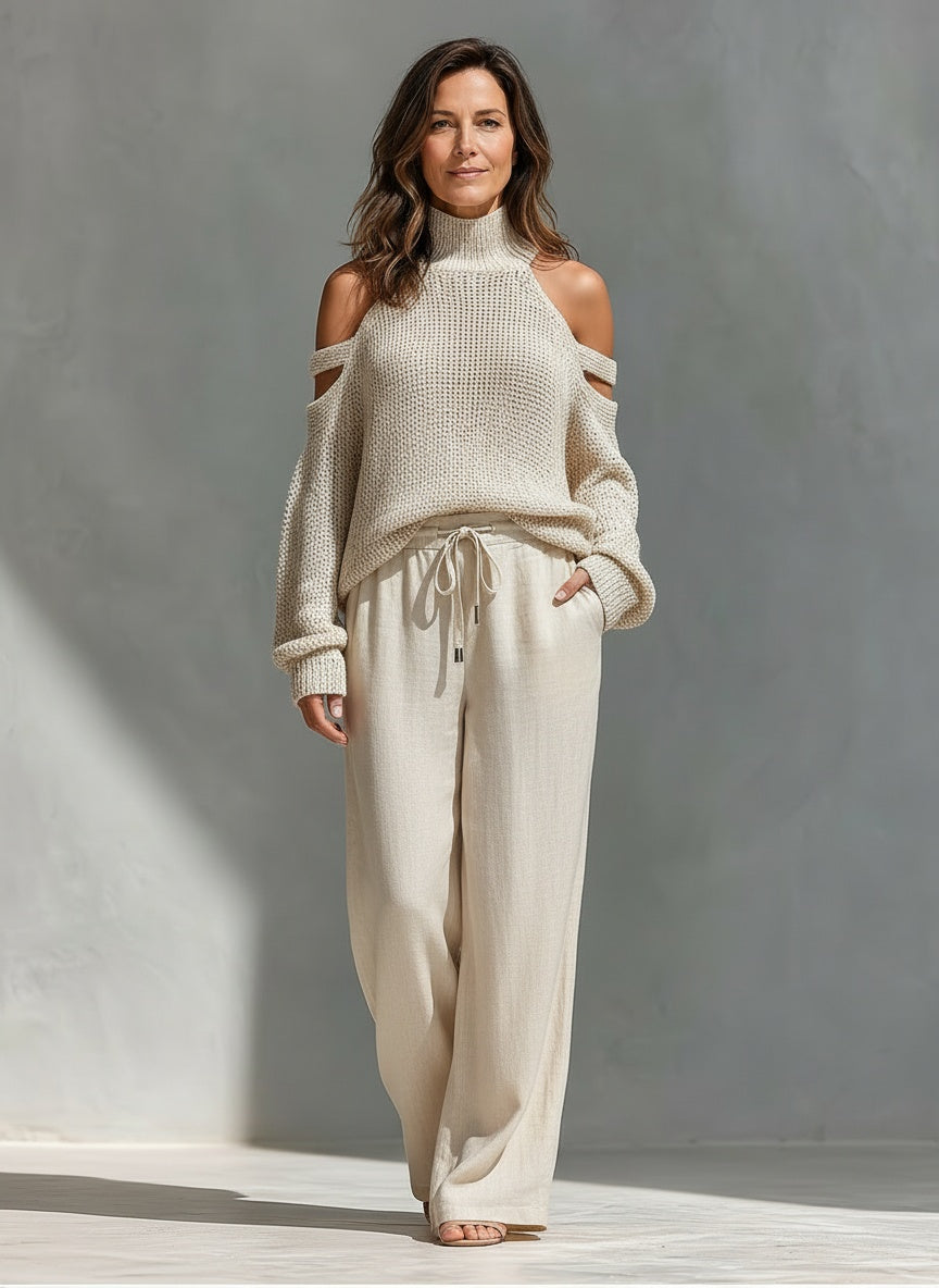 Full body view of the model wearing Zomeroutfit met col en wijde broek voor dames