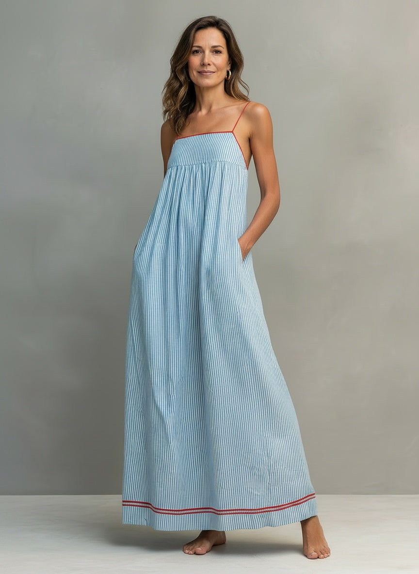 Full body view of the model wearing Maxijurk met fijne schouderbanden en bies voor dames