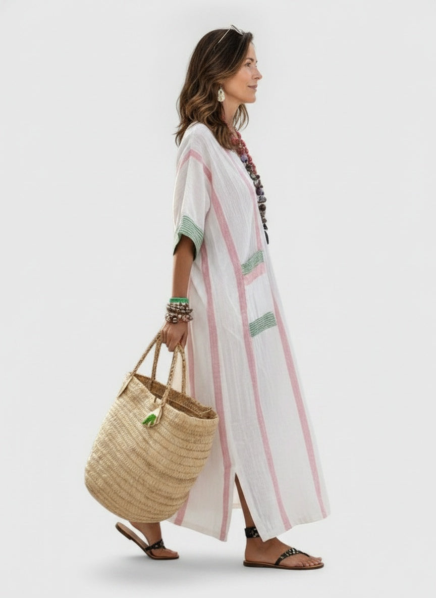Side profile of the model wearing Maxi zomerjurk voor dames